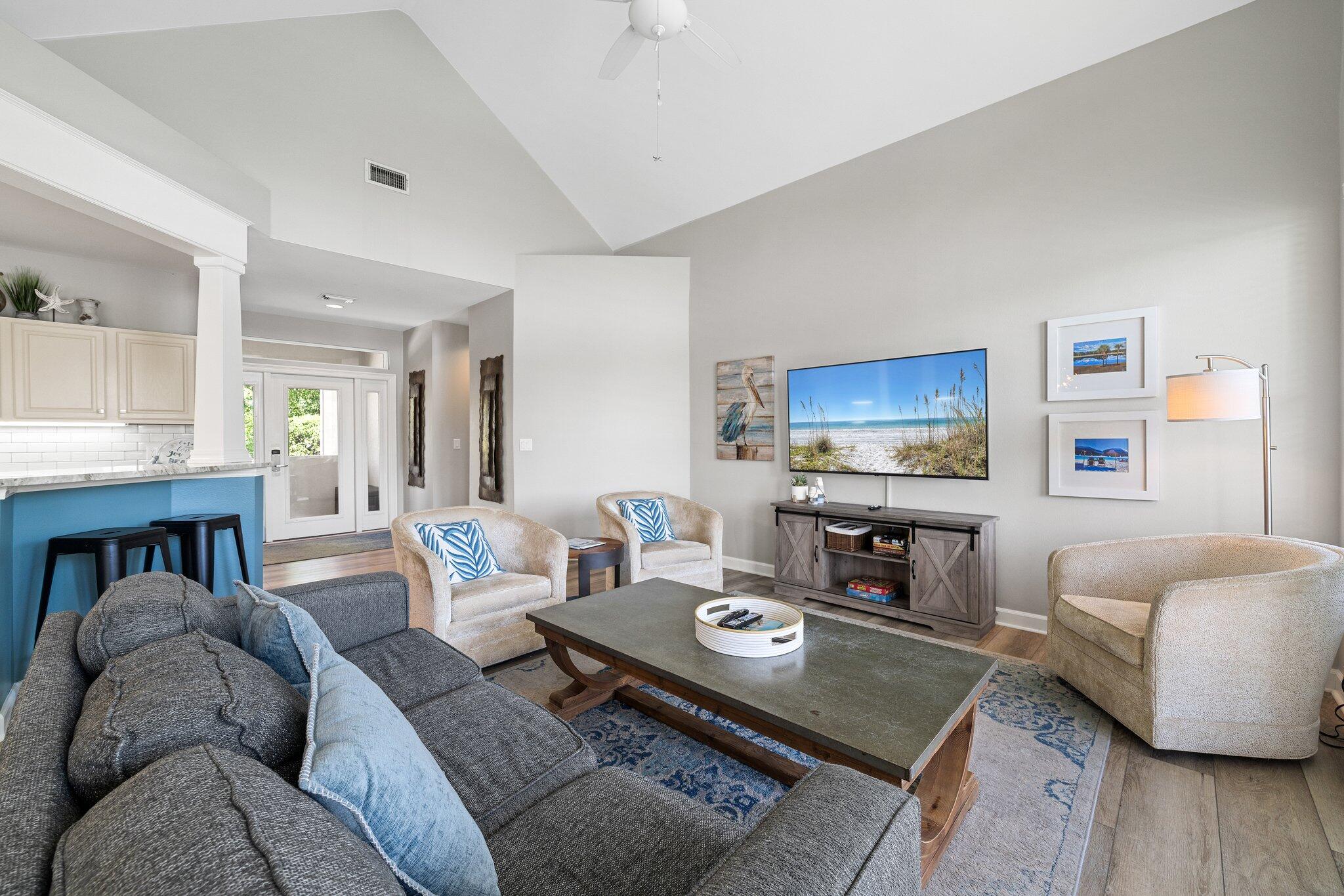 8512 Turnberry Court, Unit 8512 Miramar Beach, FL 32550 - Photo 16 of 35 a living room with furniture and a flat screen tv