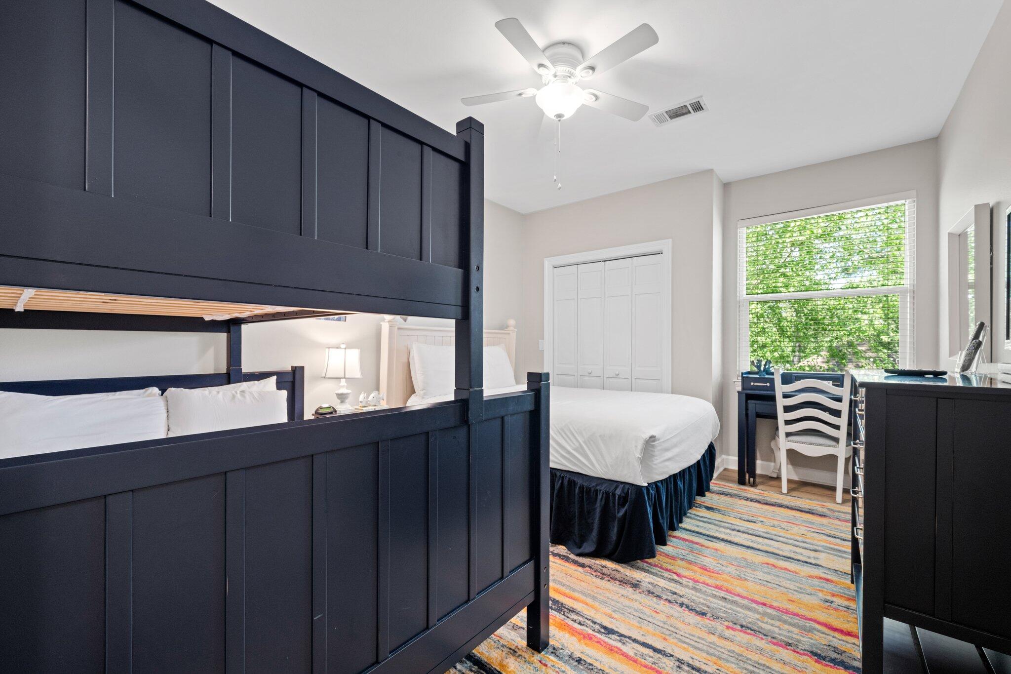 8512 Turnberry Court, Unit 8512 Miramar Beach, FL 32550 - Photo 29 of 35 a living room with furniture a bed and a large window