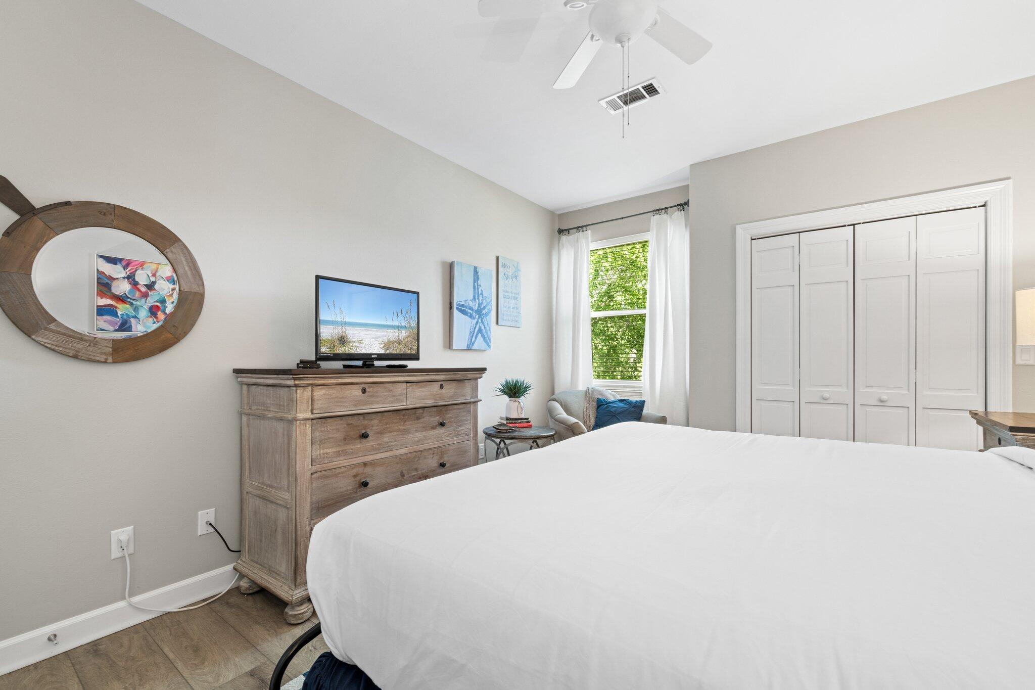 8512 Turnberry Court, Unit 8512 Miramar Beach, FL 32550 - Photo 33 of 35 a bedroom with a bed and a chandelier