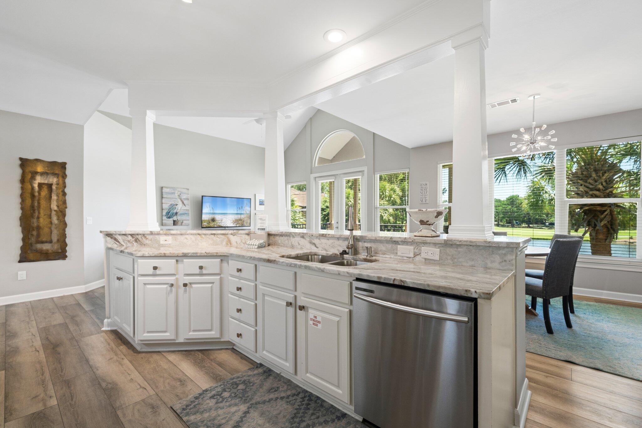 8512 Turnberry Court, Unit 8512 Miramar Beach, FL 32550 - Photo 9 of 35 a kitchen with granite countertop a sink and cabinets