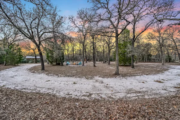 a backyard of a house with lots of green space