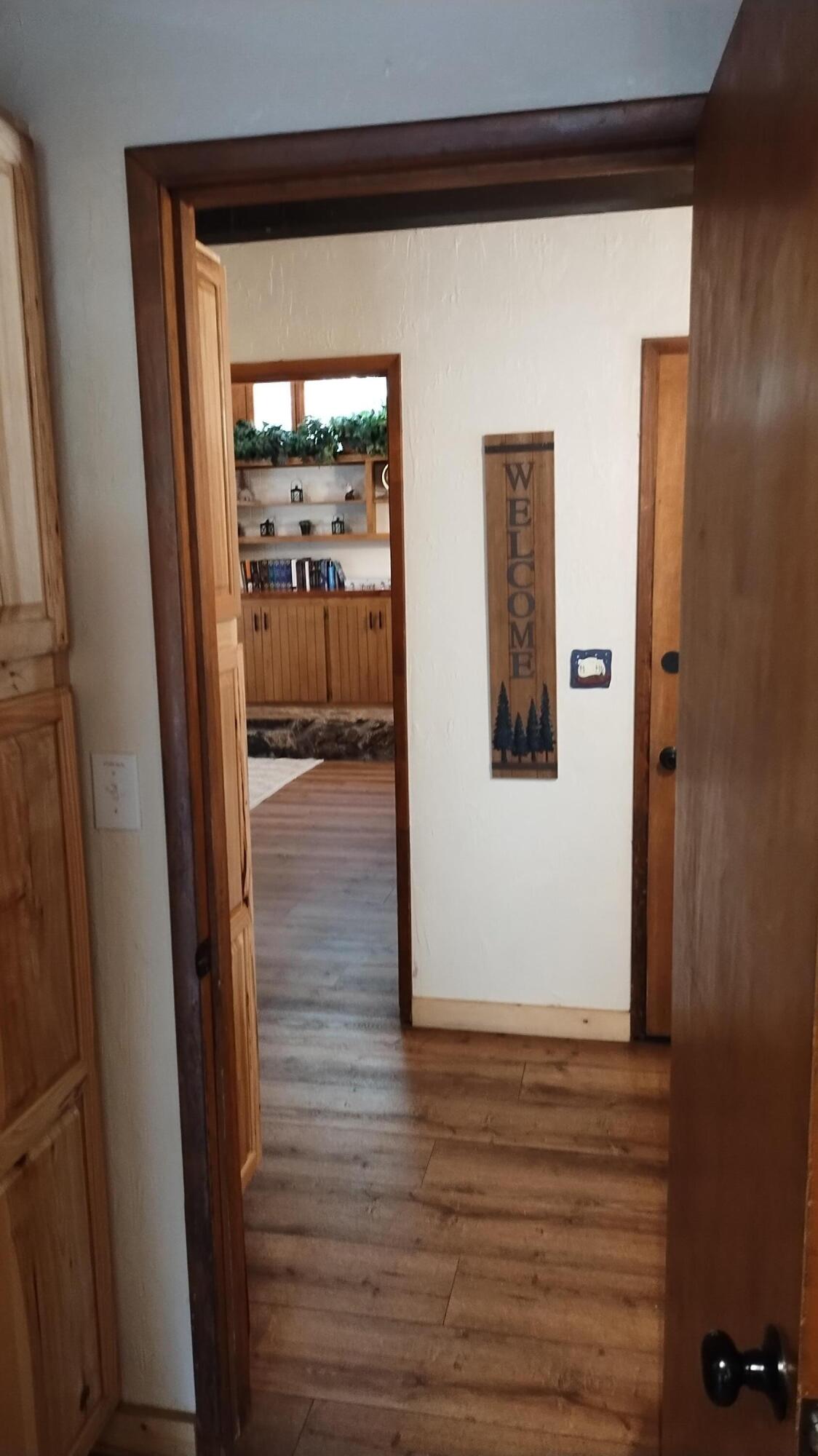 1693 Forest Rte 21S94 Camp Nelson, CA 93265 - Photo 25 of 86 a view of a hallway with wooden floor and closet