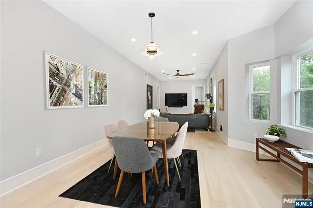 a view of a dining room with furniture window and outside view