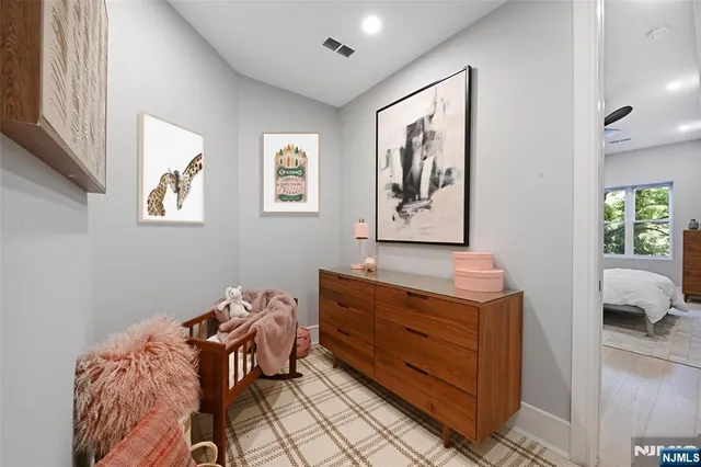 a bathroom with a toilet and a mirror