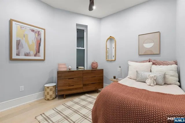 a bathroom with a sink vanity mirror and toilet