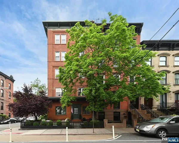 a view of a parked cars in front of a building