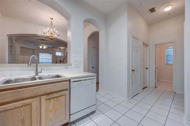 a kitchen with a sink and cabinets
