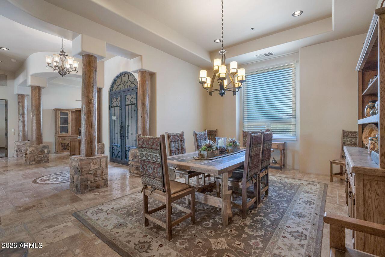 18507 East Picacho Road Rio Verde, AZ 85263 - Photo 4 of 33 a view of a dining room with furniture and a chandelier