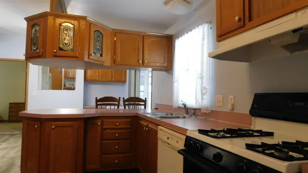 a kitchen with stainless steel appliances granite countertop a stove and a sink