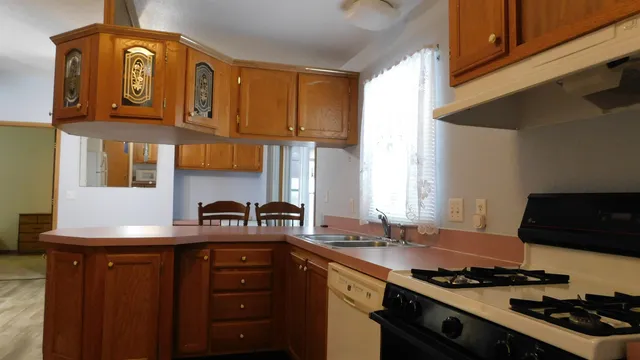 a view of kitchen with a refrigerator
