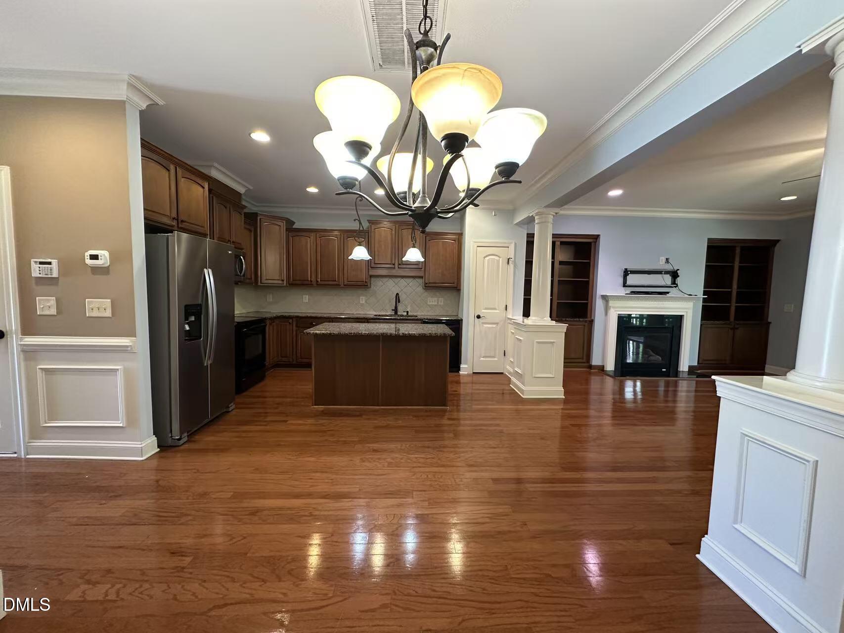 1056 Indigo Ridge Place Cary, NC 27519 - Photo 5 of 33 a view of a kitchen with cabinets and wooden floor