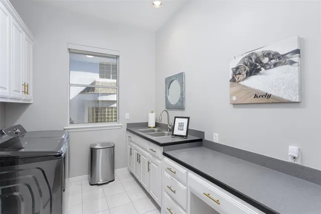 a kitchen with a sink and cabinets