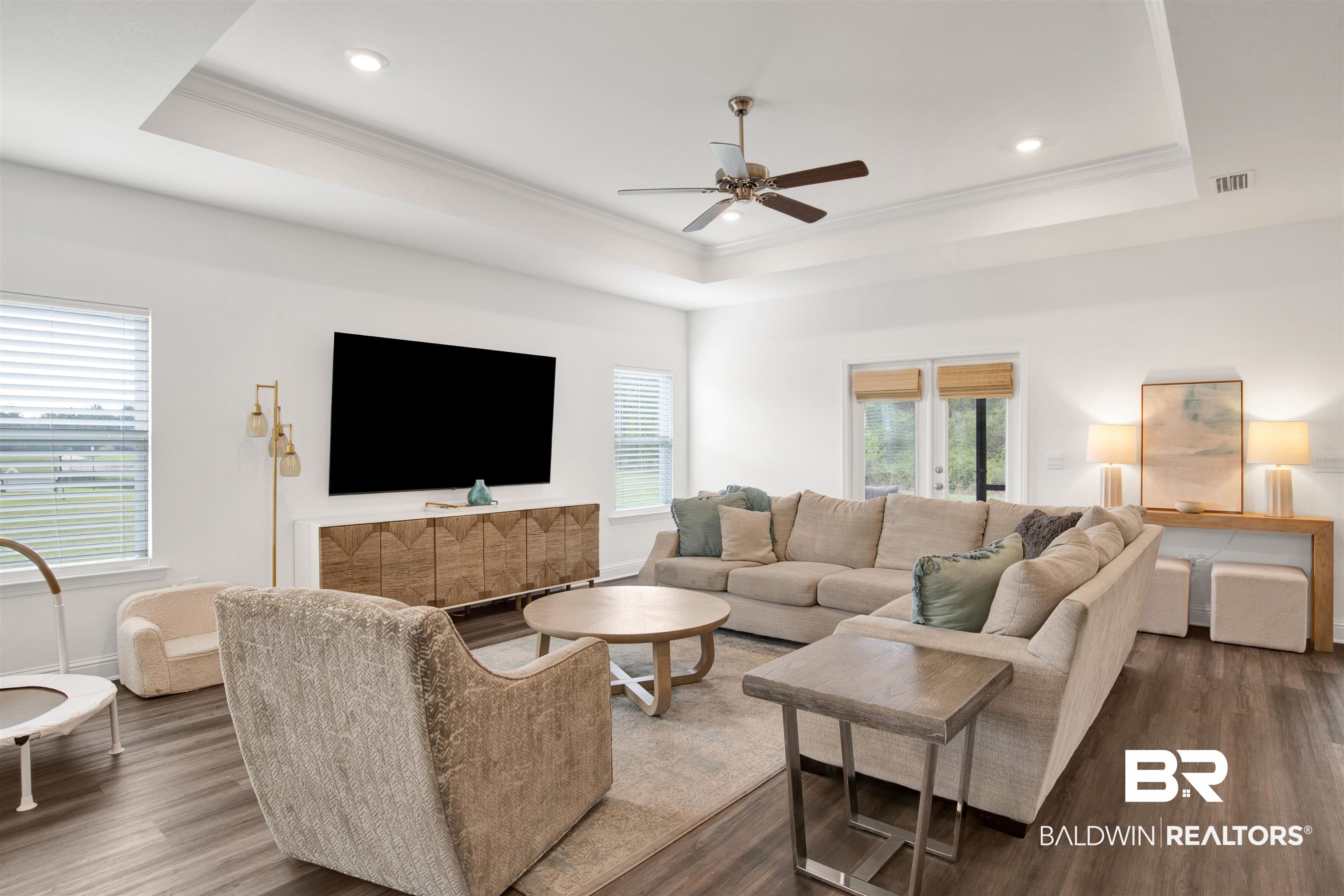 594 Shepard Street Gulf Shores, AL 36542 - Photo 25 of 51 Living area featuring ceiling fan, wood finished floors, plenty of natural light, and ornamental molding