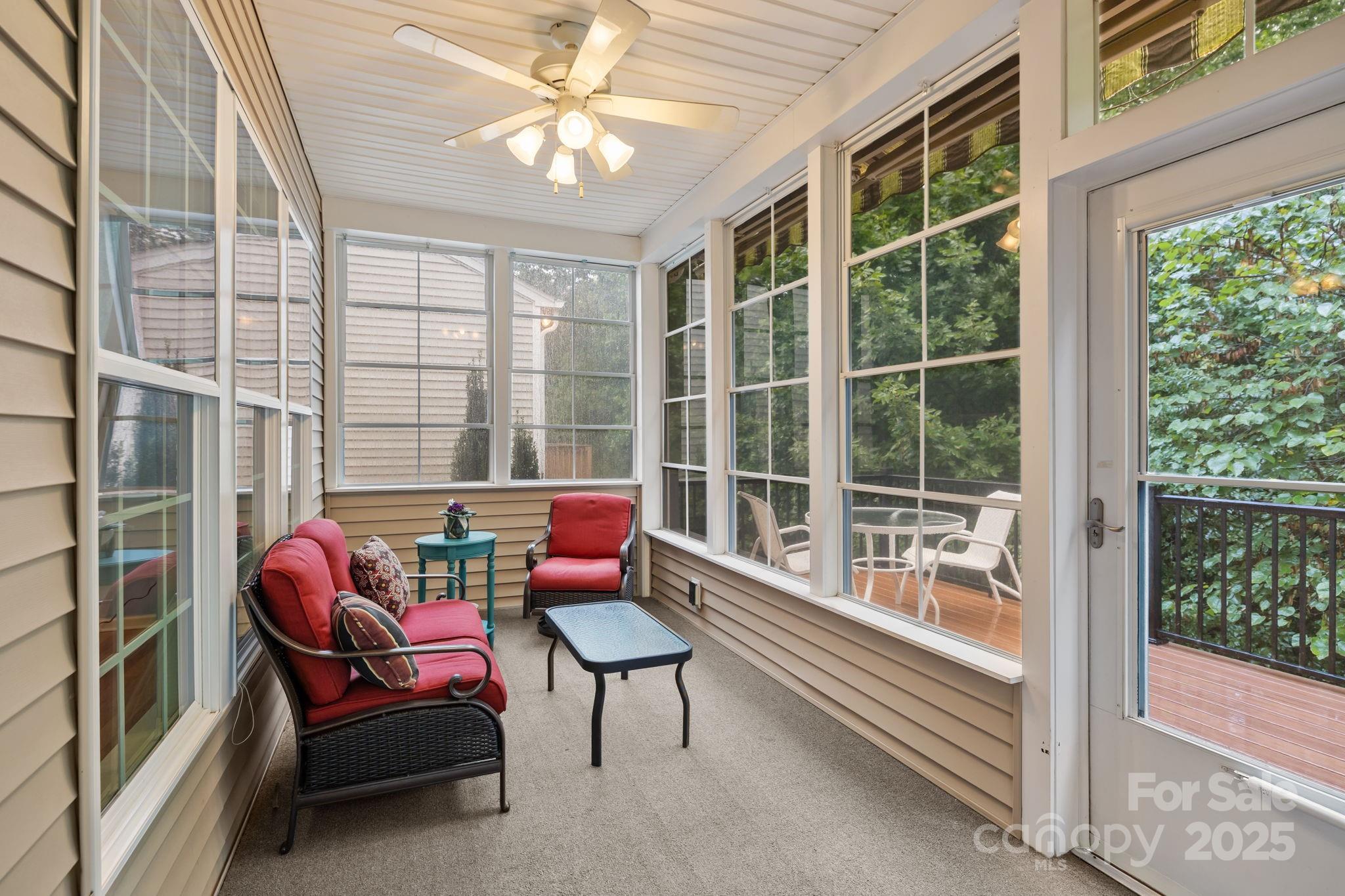 17517 Hawks View Drive, Unit 164 Fort Mill, SC 29707 - Photo 16 of 39 a living room with furniture and a floor to ceiling window