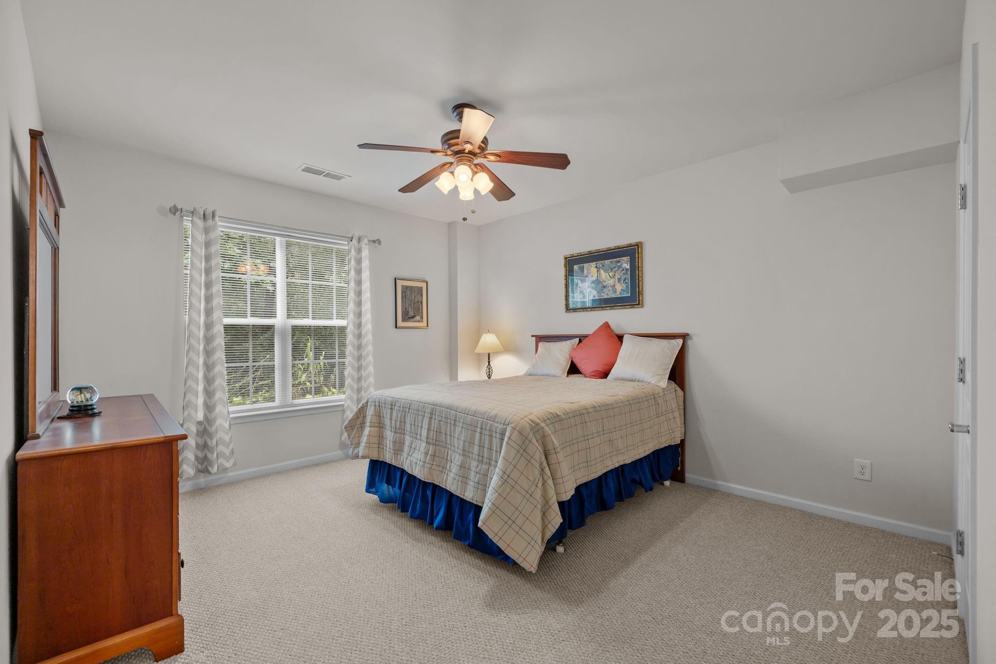 17517 Hawks View Drive, Unit 164 Fort Mill, SC 29707 - Photo 30 of 39 a bedroom with a bed and a window