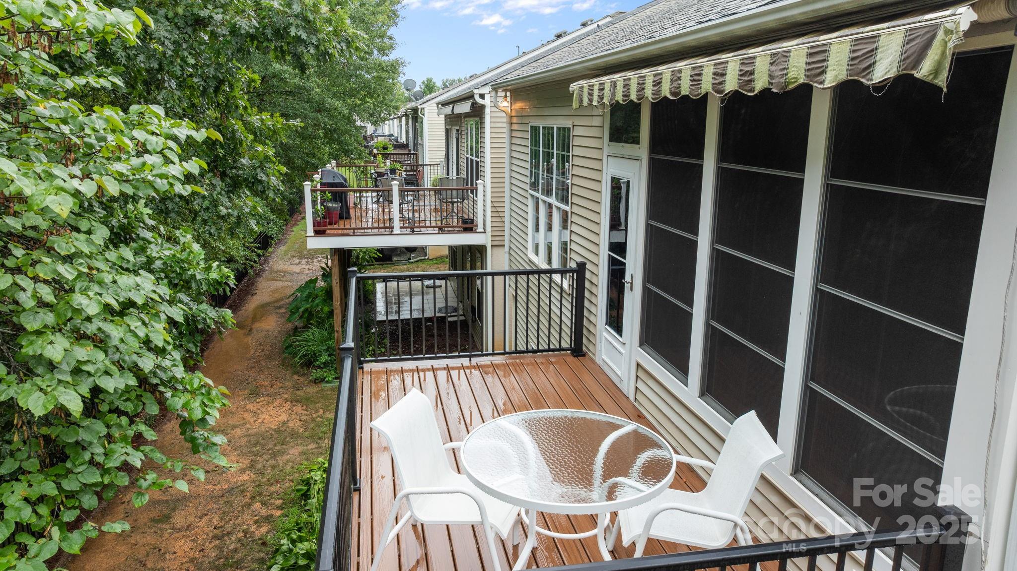 17517 Hawks View Drive, Unit 164 Fort Mill, SC 29707 - Photo 37 of 39 a balcony with table and chairs