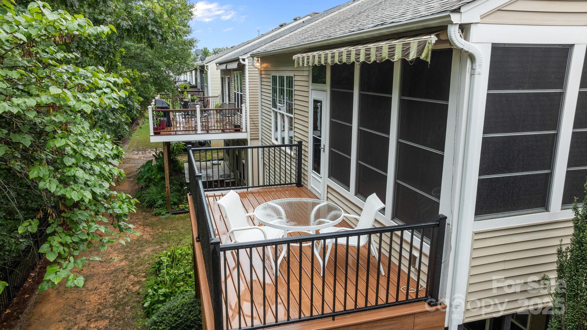 17517 Hawks View Drive, Unit 164 Fort Mill, SC 29707 - Photo 38 of 39 a view of deck with a large window and wooden fence