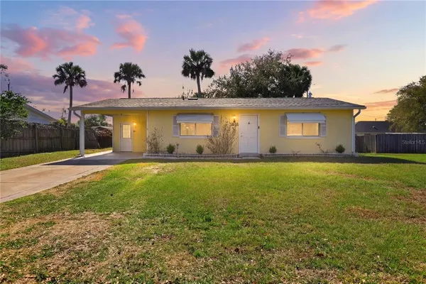 a front view of house with yard and outdoor space