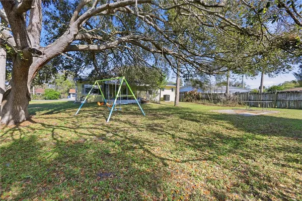 a view of a yard with a tree