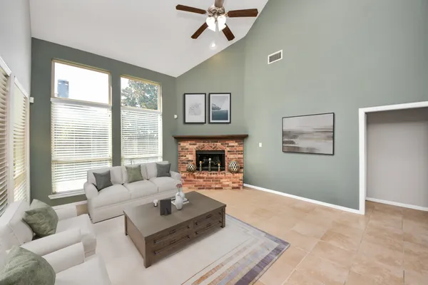 a living room with furniture and a fireplace