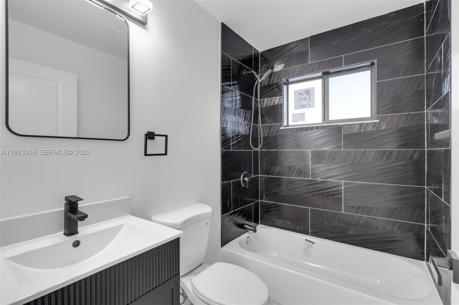 1413 Northwest 40th Street Miami, FL 33142 - Photo 15 of 30 a bathroom with a sink toilet and shower