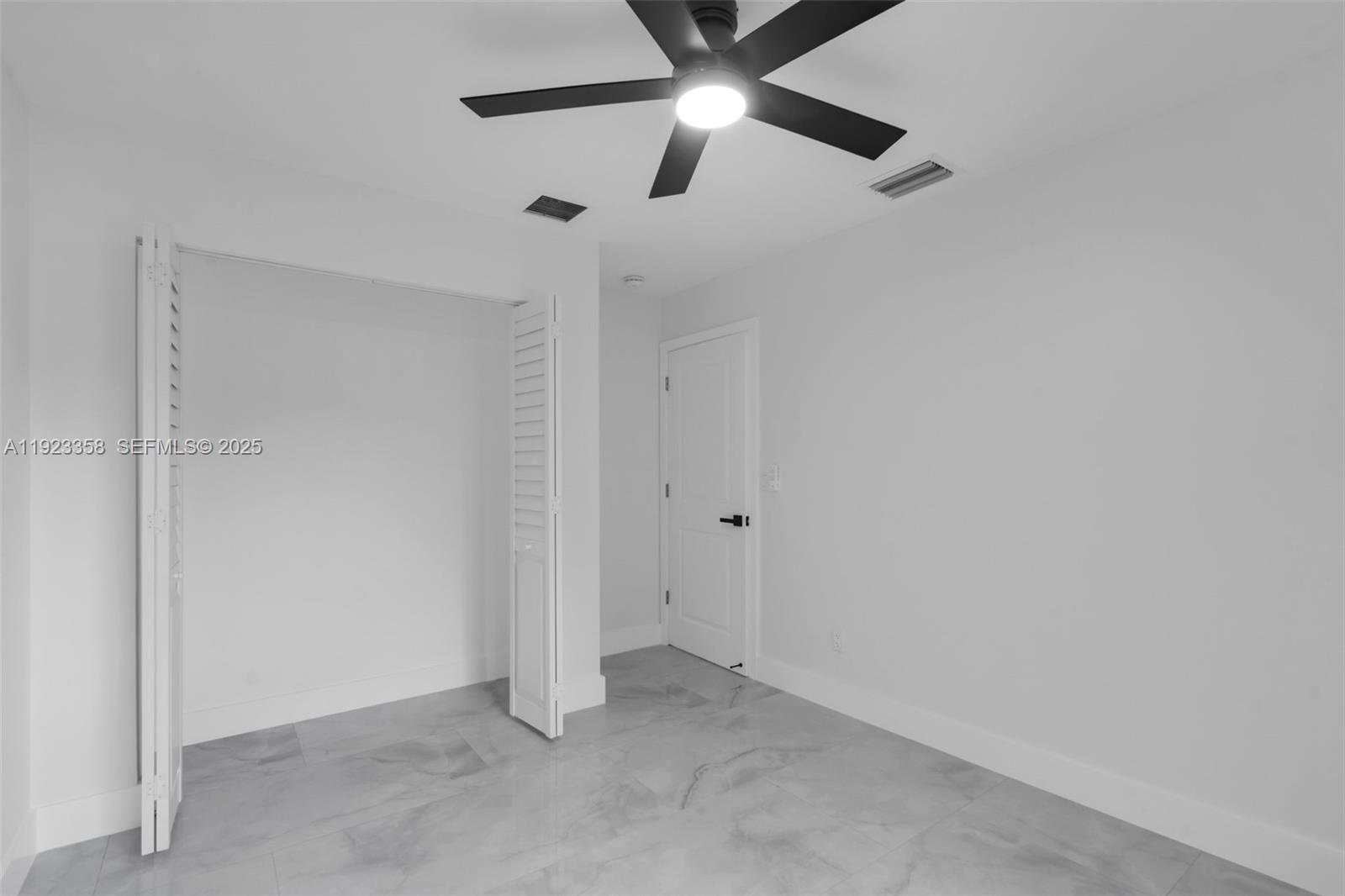 1413 Northwest 40th Street Miami, FL 33142 - Photo 20 of 30 wooden floor in an empty room