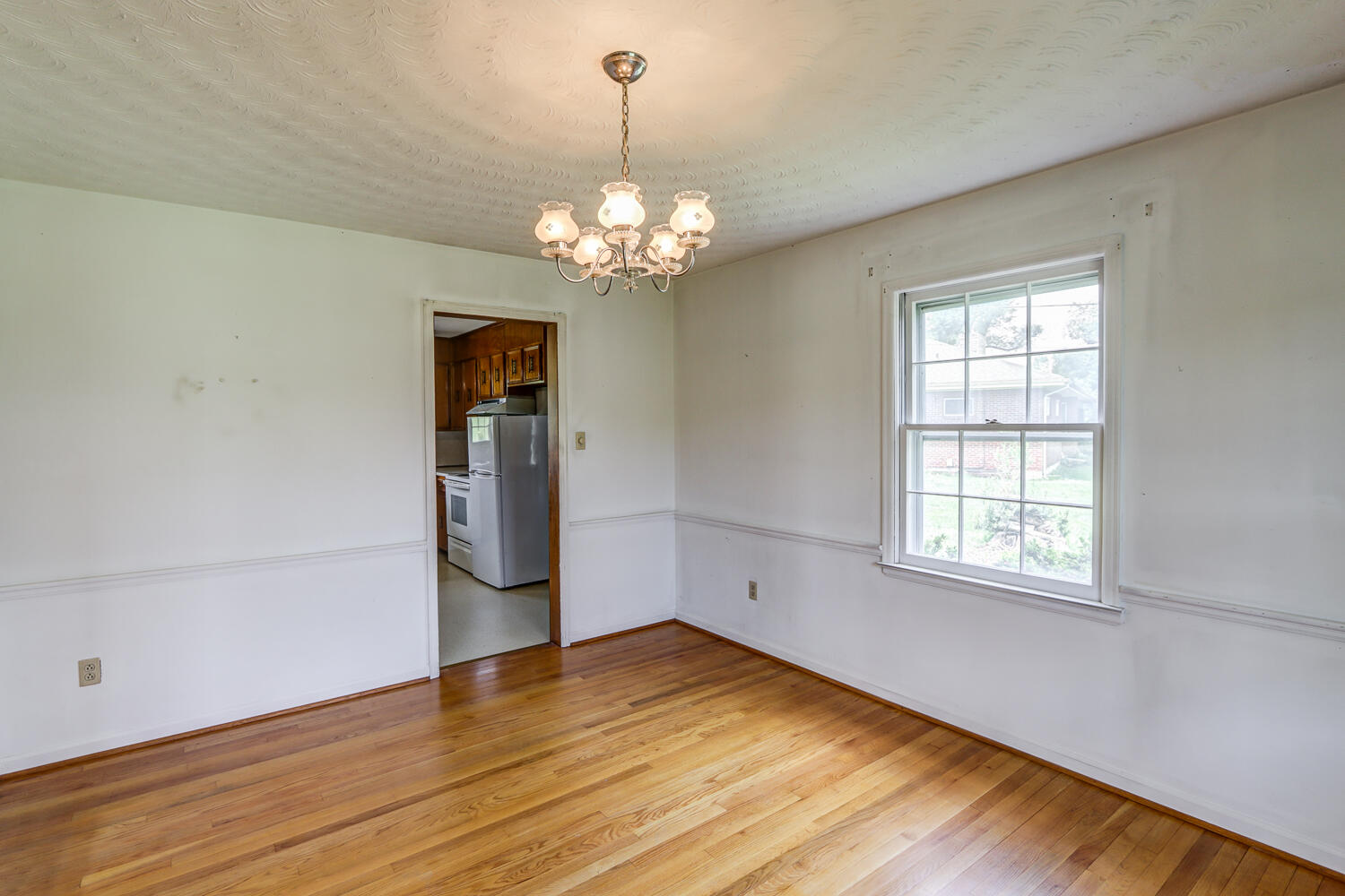 2231 Hardy Road Vinton, VA 24179 - Photo 13 of 40 a view of a room with wooden floor and chandelier