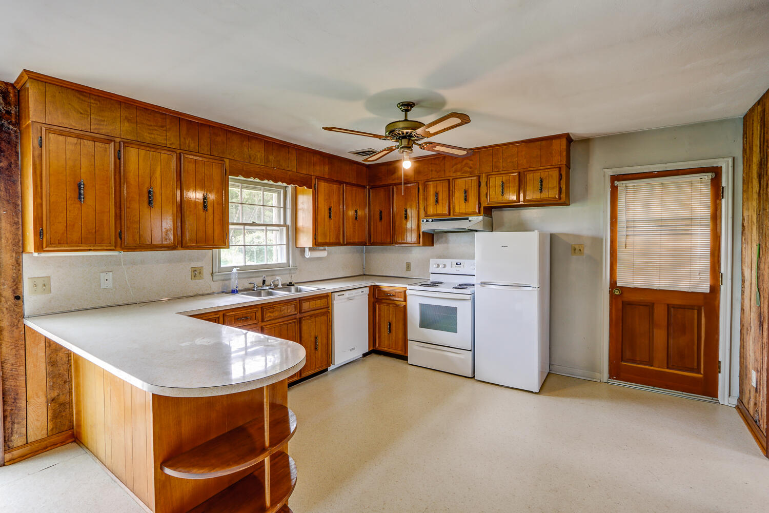 2231 Hardy Road Vinton, VA 24179 - Photo 17 of 40 a kitchen with a stove a sink and a refrigerator