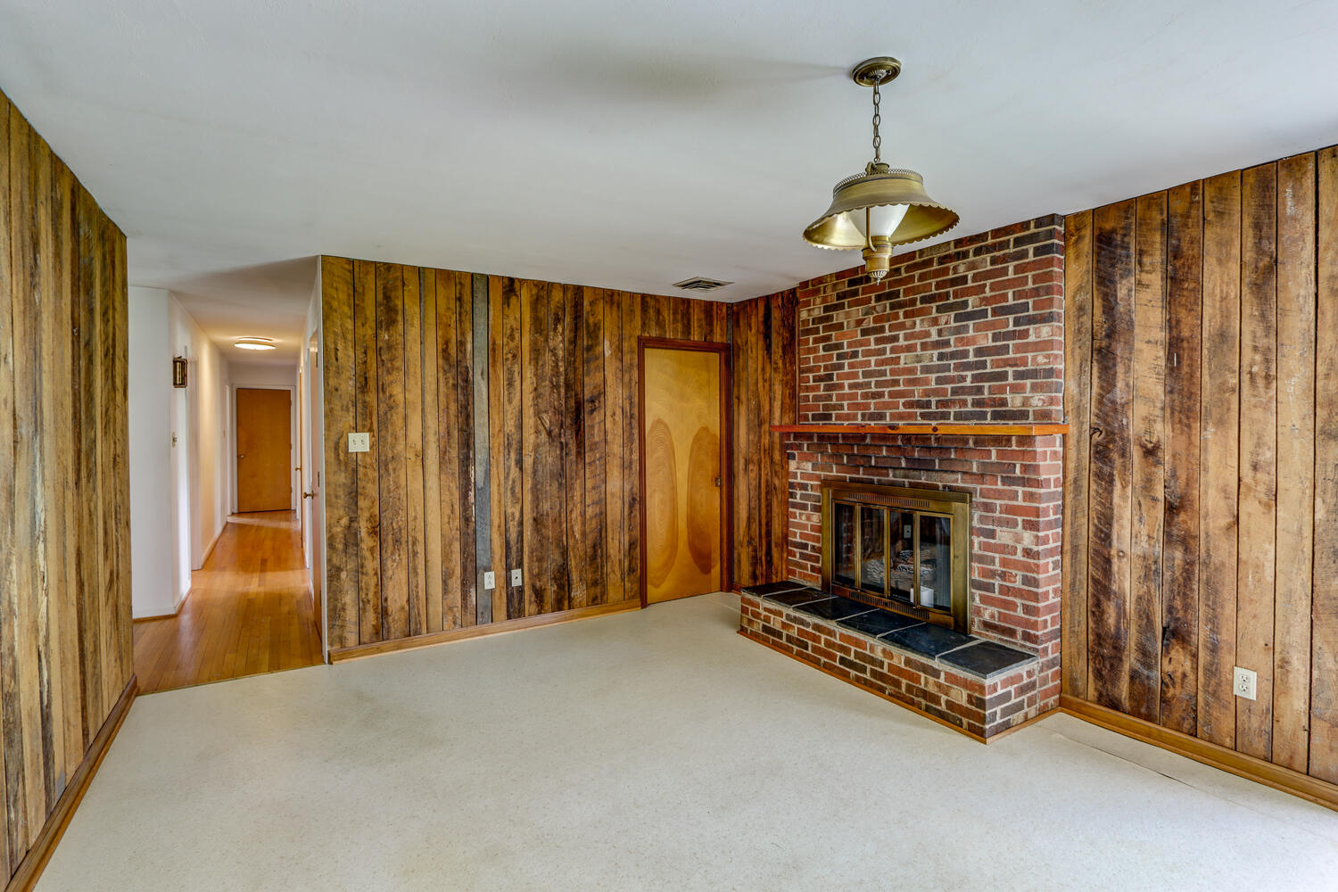 2231 Hardy Road Vinton, VA 24179 - Photo 19 of 40 a living room with furniture and a fireplace