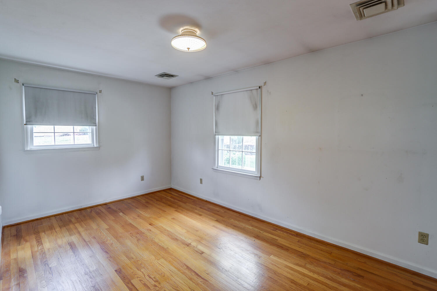 2231 Hardy Road Vinton, VA 24179 - Photo 20 of 40 an empty room with wooden floor and windows