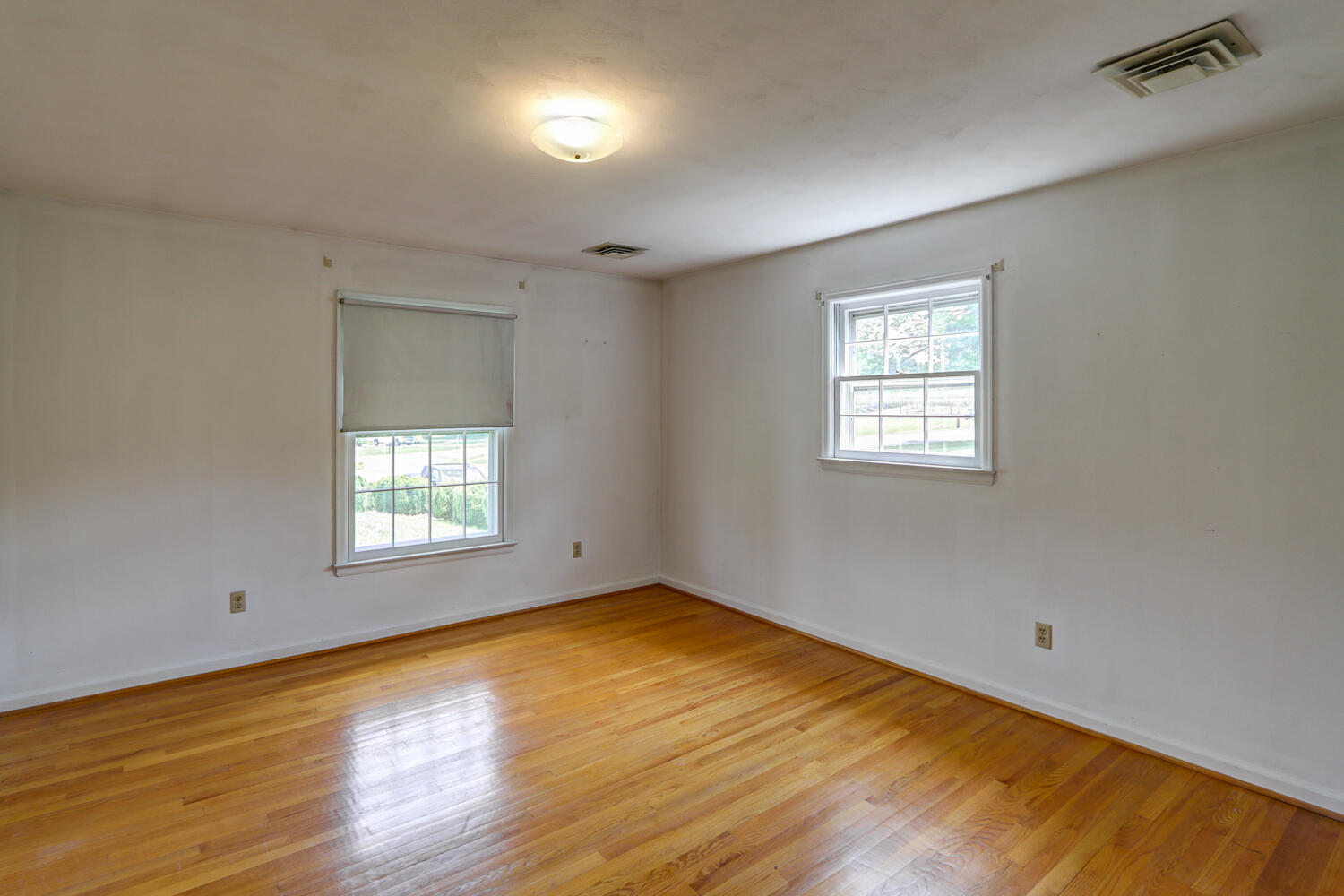 2231 Hardy Road Vinton, VA 24179 - Photo 23 of 40 a view of empty room with wooden floor and fan