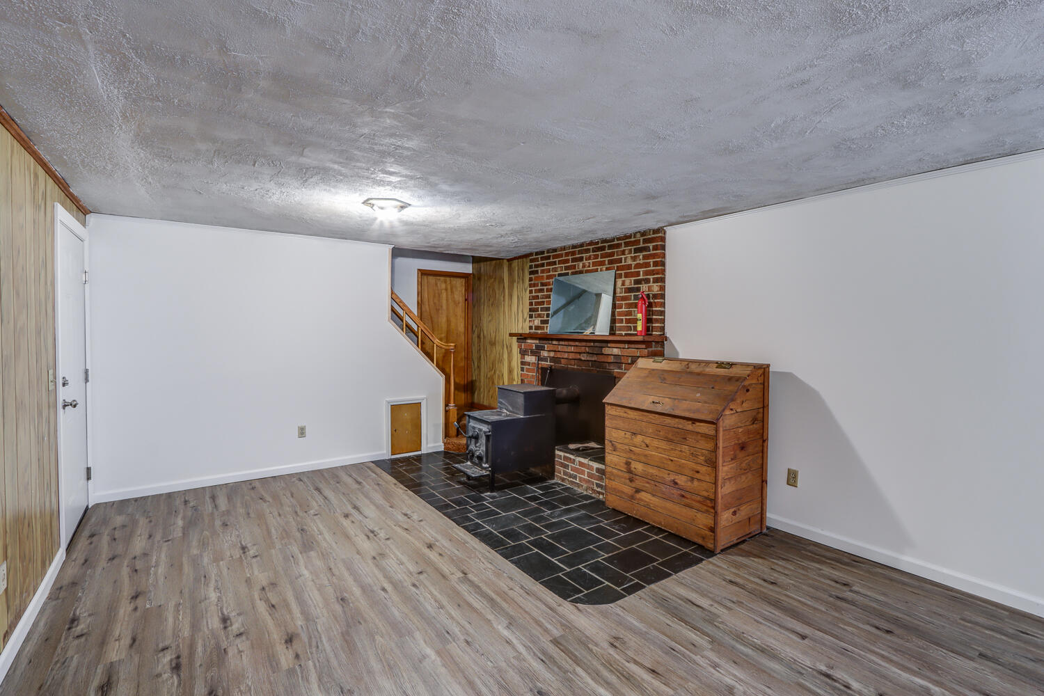 2231 Hardy Road Vinton, VA 24179 - Photo 26 of 40 a room with furniture and a wooden floor