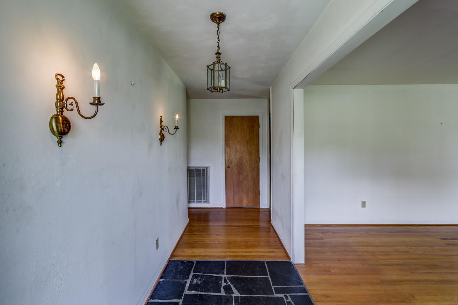 2231 Hardy Road Vinton, VA 24179 - Photo 9 of 40 a view of a hallway with chandelier
