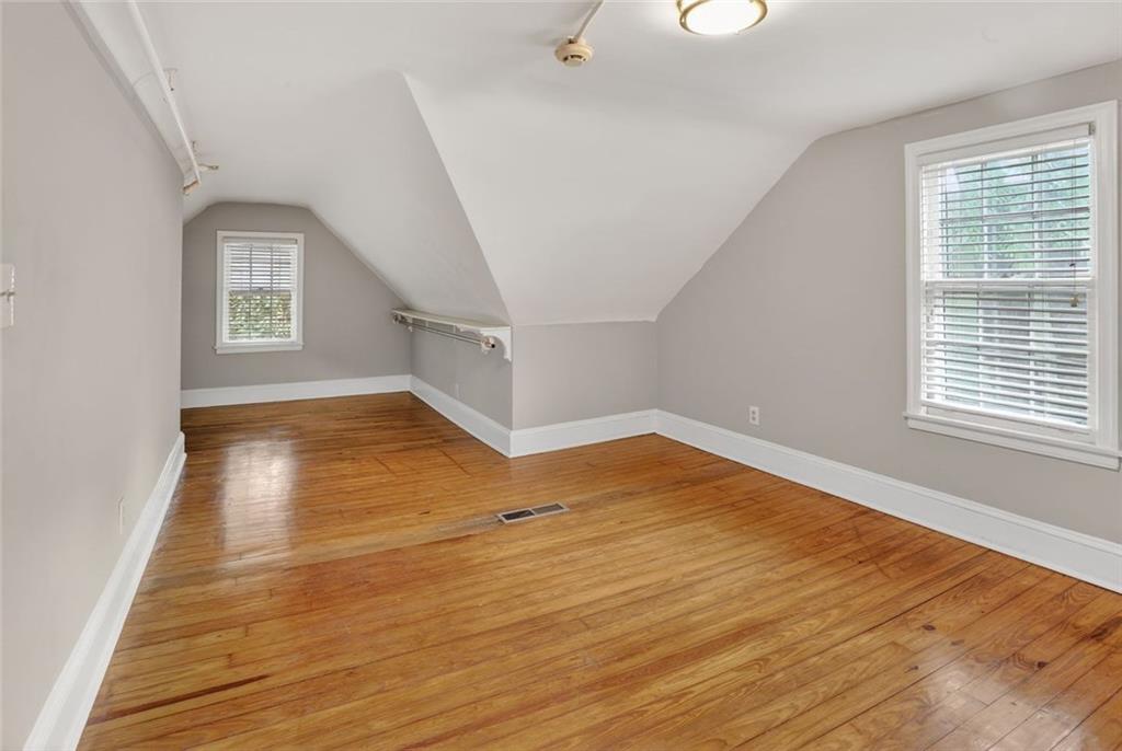 2728 Winburn Terrace Atlanta, GA 30344 - Photo 11 of 16 a view of empty room with wooden floor and fan