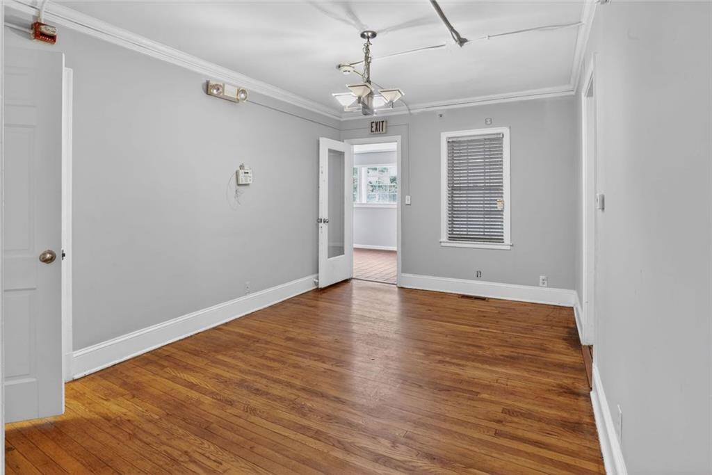 2728 Winburn Terrace Atlanta, GA 30344 - Photo 4 of 16 wooden floor in an empty room with a window