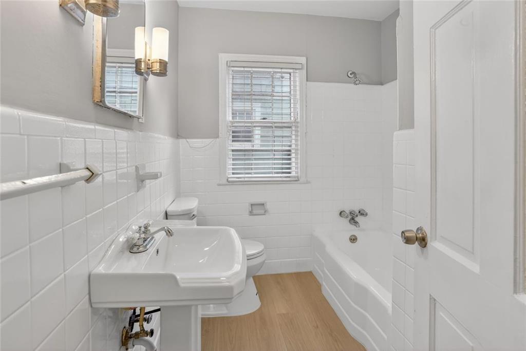 2728 Winburn Terrace Atlanta, GA 30344 - Photo 9 of 16 a bathroom with a sink and a bathtub