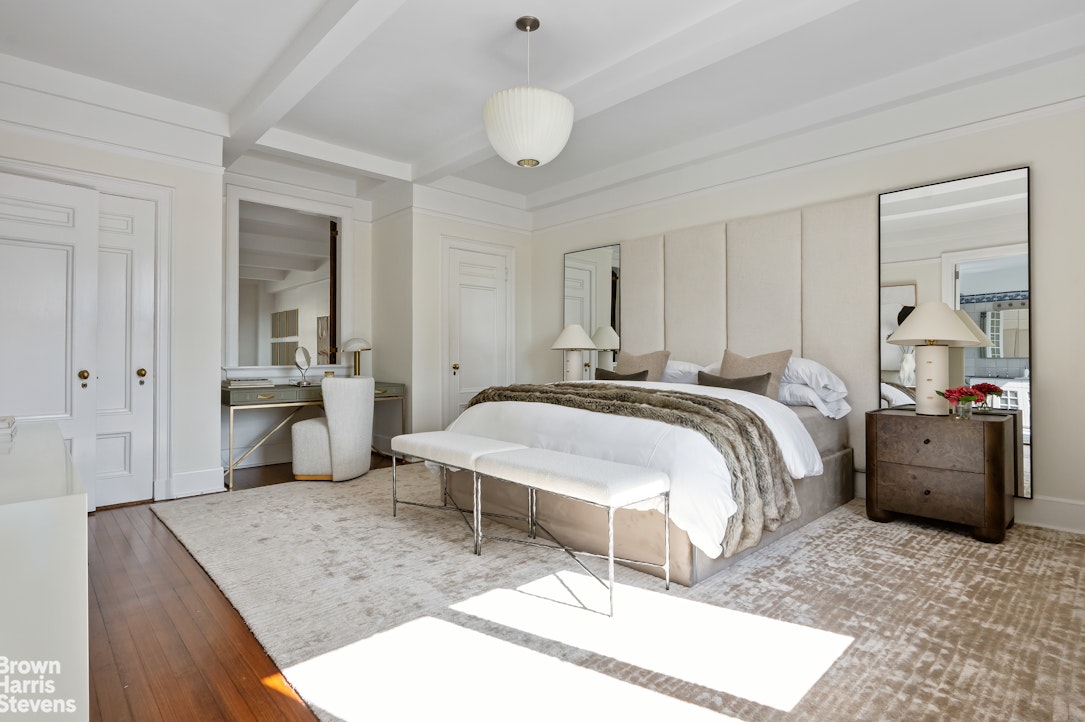 257 West 86th Street, Unit PHA Manhattan, NY 10024 - Photo 10 of 17 a bedroom with a bed and a couch