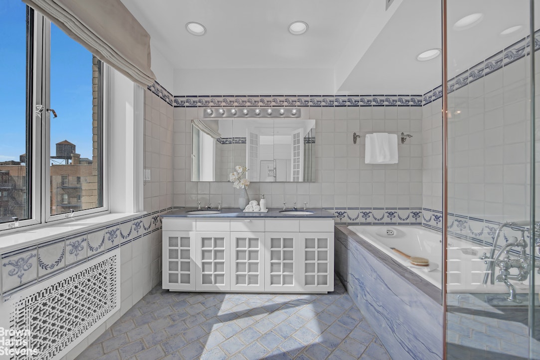 257 West 86th Street, Unit PHA Manhattan, NY 10024 - Photo 12 of 17 a spacious bathroom with a tub a double vanity sink and a mirror