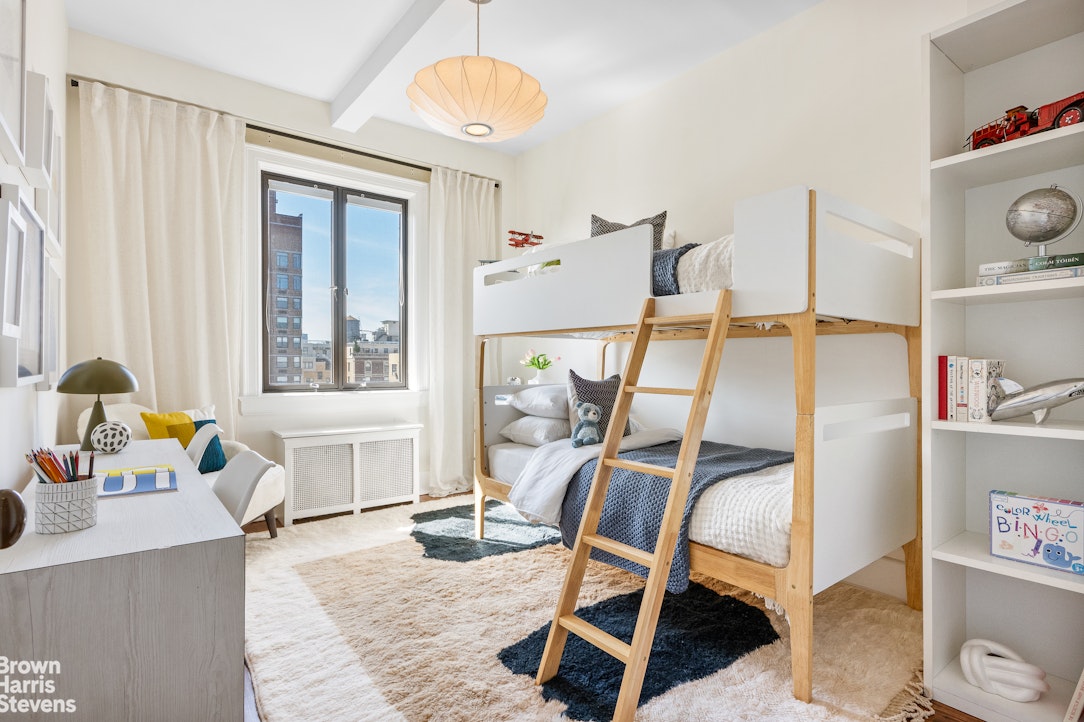 257 West 86th Street, Unit PHA Manhattan, NY 10024 - Photo 14 of 17 a dining room with wooden floor and a chandelier