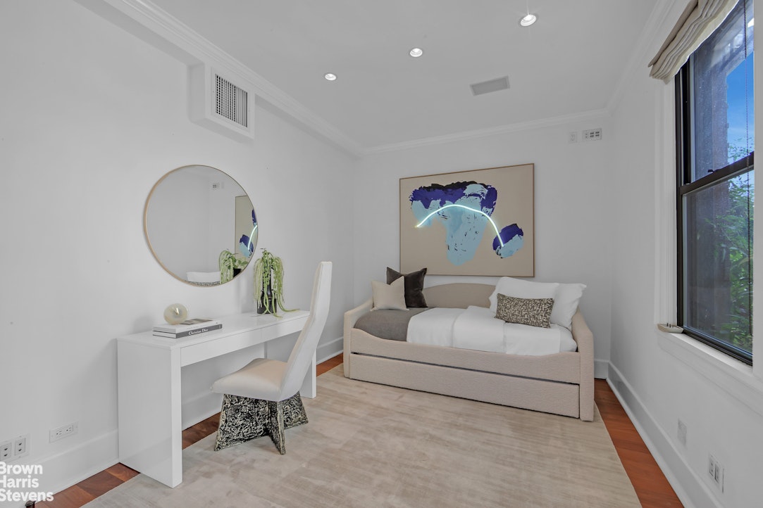257 West 86th Street, Unit PHA Manhattan, NY 10024 - Photo 15 of 17 a living room with furniture a mirror and a window