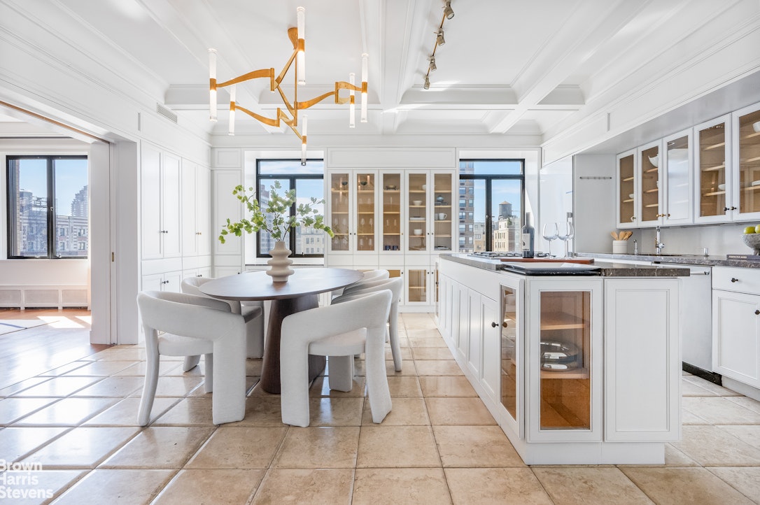 257 West 86th Street, Unit PHA Manhattan, NY 10024 - Photo 5 of 17 a kitchen with granite countertop a sink and cabinets