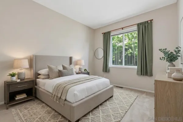 a bedroom with a bed and window