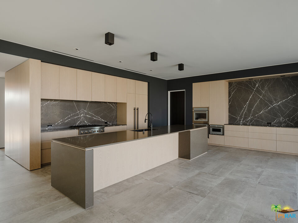 5 Echo Lane Rancho Mirage, CA 92270 - Photo 18 of 24 a kitchen with stainless steel appliances a stove and a refrigerator