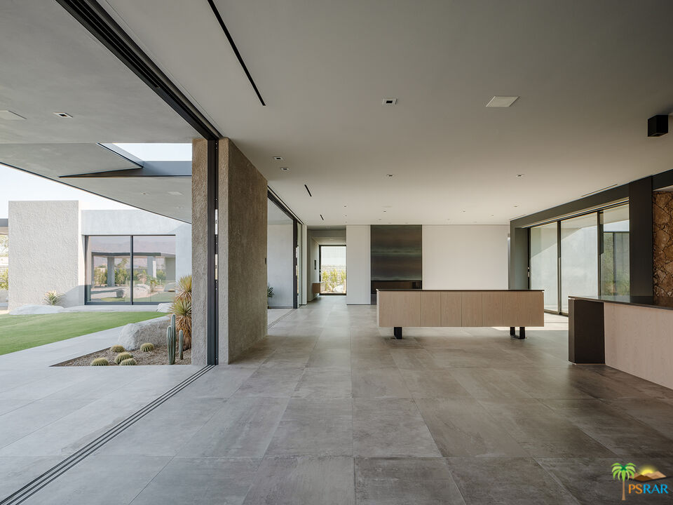 5 Echo Lane Rancho Mirage, CA 92270 - Photo 19 of 24 a view of an empty room with a fireplace and a large window