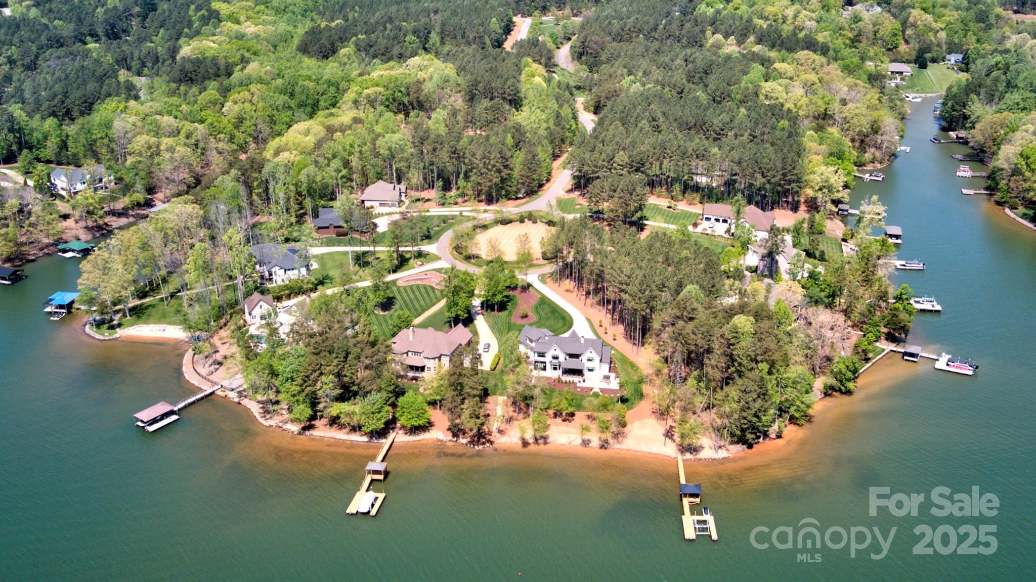 111 Cinder Ridge Court Troutman, NC 28166 - Photo 1 of 23 an aerial view of a house with a yard and lake view