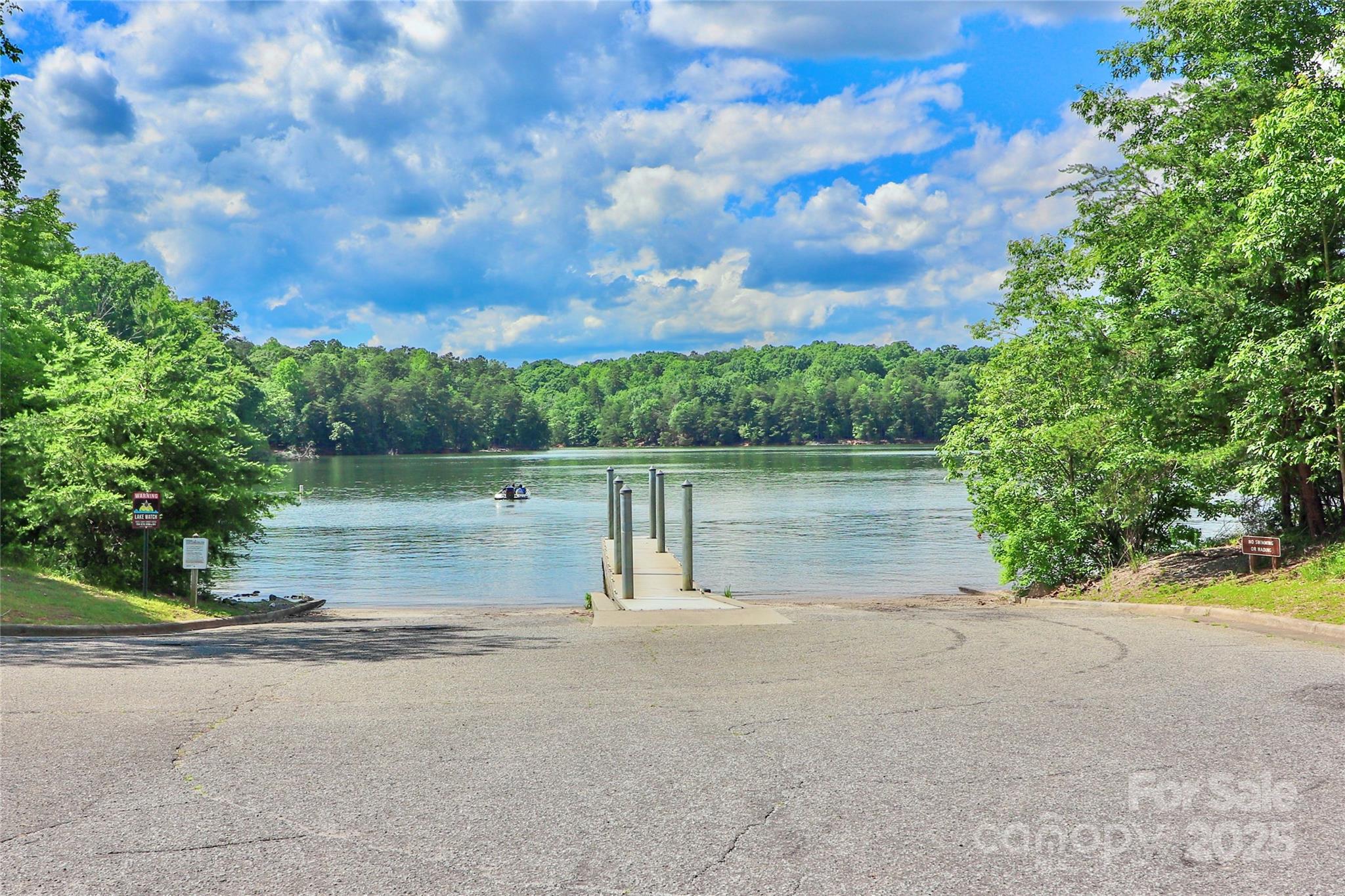111 Cinder Ridge Court Troutman, NC 28166 - Photo 19 of 23 a view of a lake view with a garden