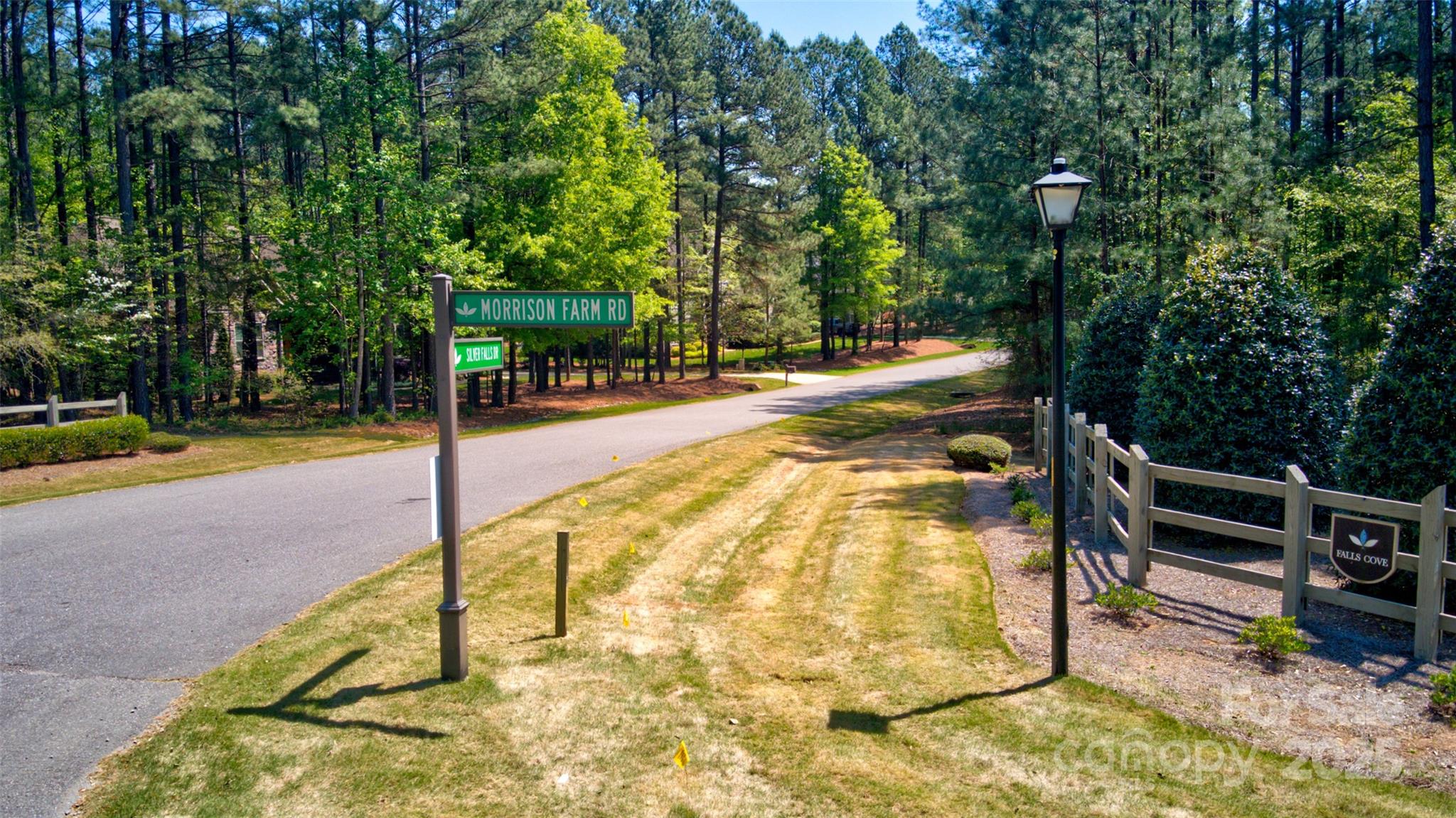 111 Cinder Ridge Court Troutman, NC 28166 - Photo 7 of 23 a view of a swimming pool with a bench and trees