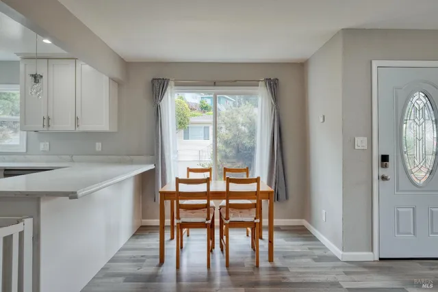 a kitchen with sink refrigerator and cabinets