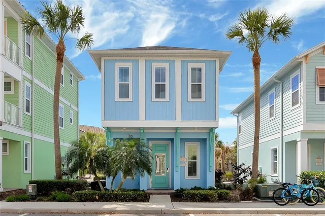 a front view of a multi story building with a yard