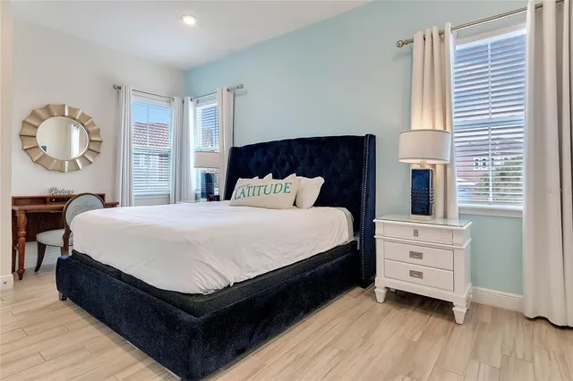 a bedroom with a bed and a dresser